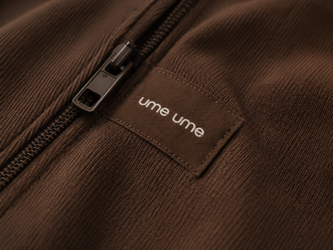 Brown zipper and fabric detail close-up from ume ume garment
